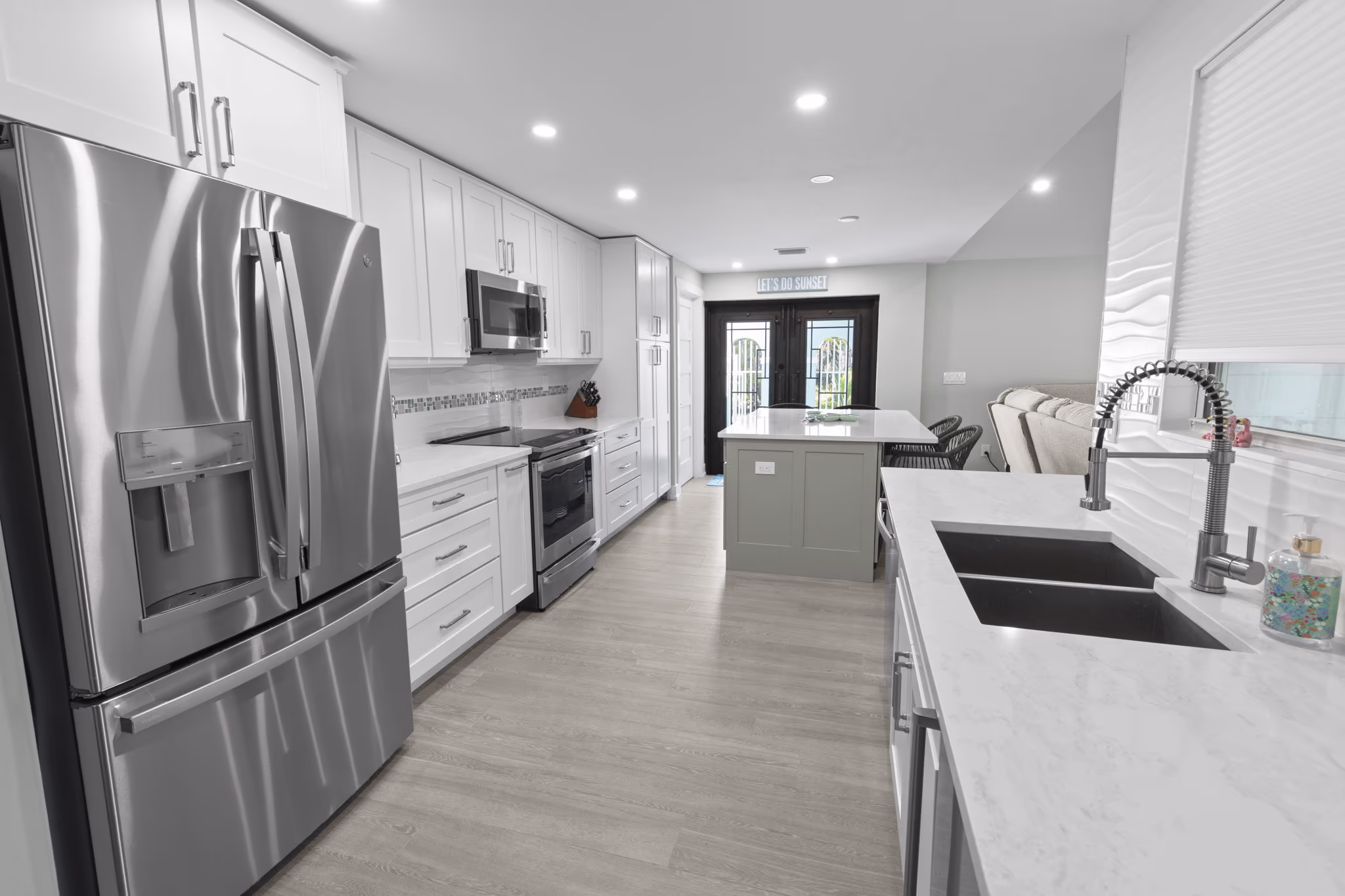 Modern kitchen renovation with white cabinetry