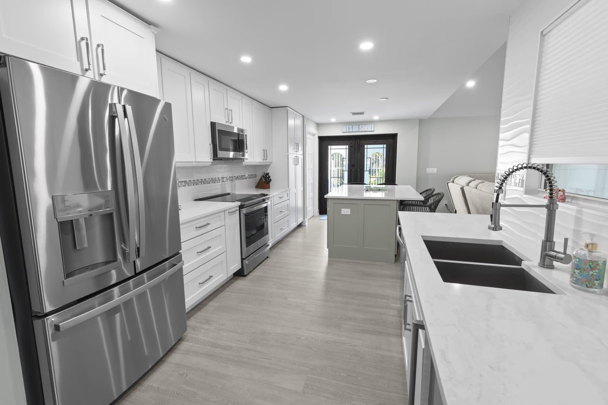 Modern kitchen renovation with white cabinetry